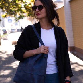 woman with blue tote bag
